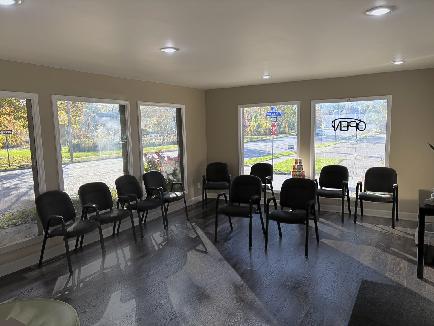Bright waiting room with chairs and large windows at Soldano Family Chiropractic in Kalamazoo
